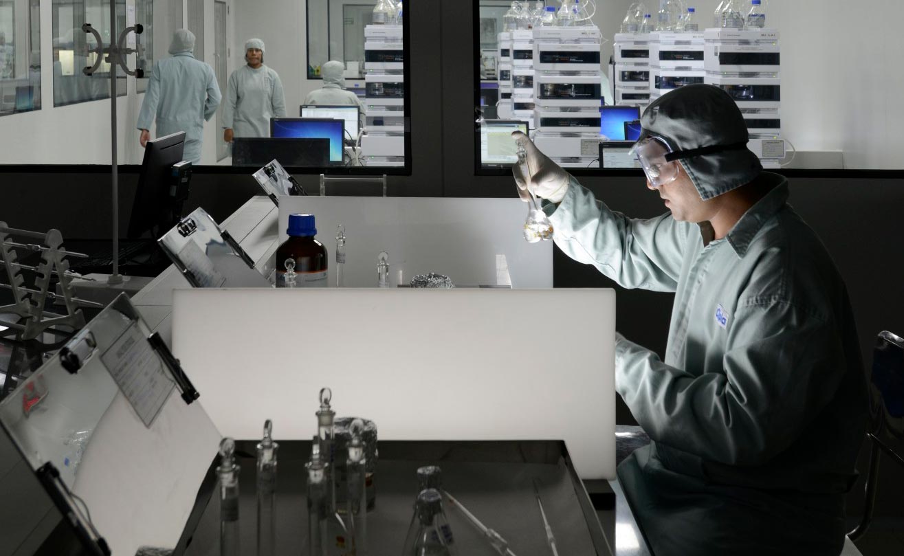 Scientist analyzing experiment apparatus